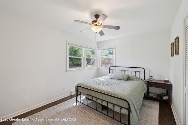 1571 Forest Hills Dr, Okemos, MI 48864 - bedroom featuring wood finished floors, baseboards, and ceiling fan