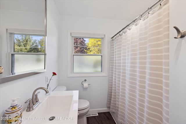 1571 Forest Hills Dr, Okemos, MI 48864 - bathroom featuring toilet, vanity, baseboards, wood finished floors, and a shower with curtain
