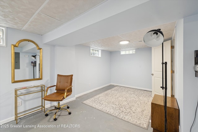 1571 Forest Hills Dr, Okemos, MI 48864 - living area with finished concrete flooring, electric panel, and baseboards
