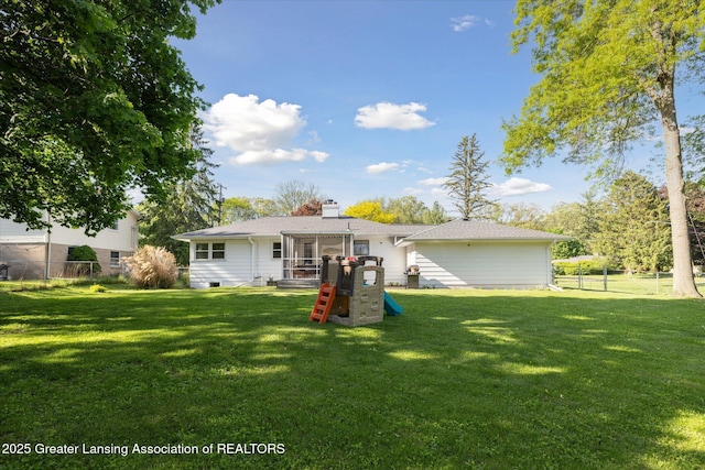1571 Forest Hills Dr, Okemos, MI 48864 - back of house featuring a sunroom and a chimney