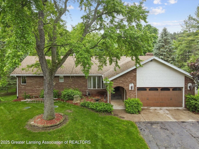 1346 E Howe Rd, Dewitt, MI 48820 - view of front of property featuring brick siding, concrete driveway, an attached garage, and a front lawn
