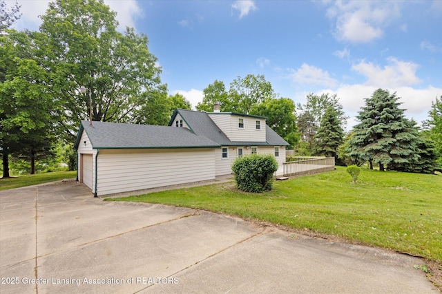1116 W Service Rd, Mason, MI 48854 - view of property exterior with a lawn, driveway, a wooden deck, and a chimney
