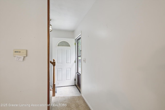 1116 W Service Rd, Mason, MI 48854 - hallway featuring light carpet and baseboards