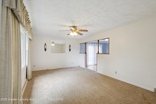 1116 W Service Rd, Mason, MI 48854 - unfurnished room with ceiling fan, carpet floors, and baseboards
