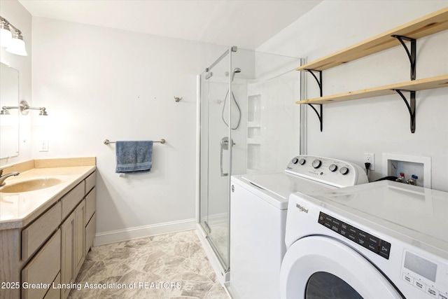 1116 W Service Rd, Mason, MI 48854 - laundry room featuring washing machine and dryer and baseboards