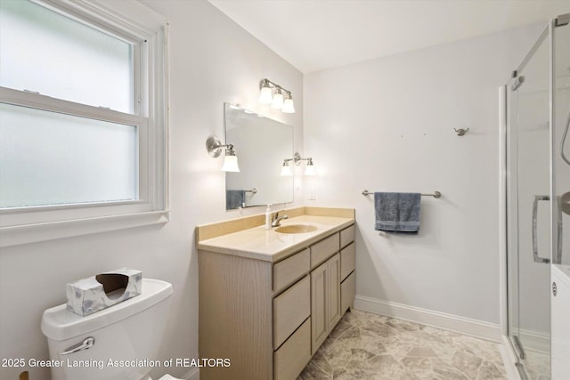 1116 W Service Rd, Mason, MI 48854 - bathroom featuring vanity, toilet, a stall shower, and baseboards
