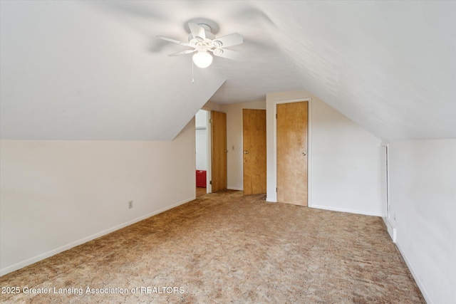 1116 W Service Rd, Mason, MI 48854 - bonus room featuring carpet floors, a ceiling fan, lofted ceiling, and baseboards