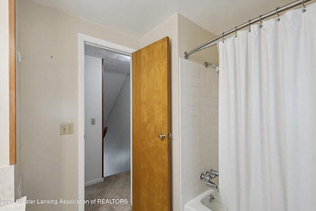 1116 W Service Rd, Mason, MI 48854 - bathroom featuring shower / bath combo with shower curtain