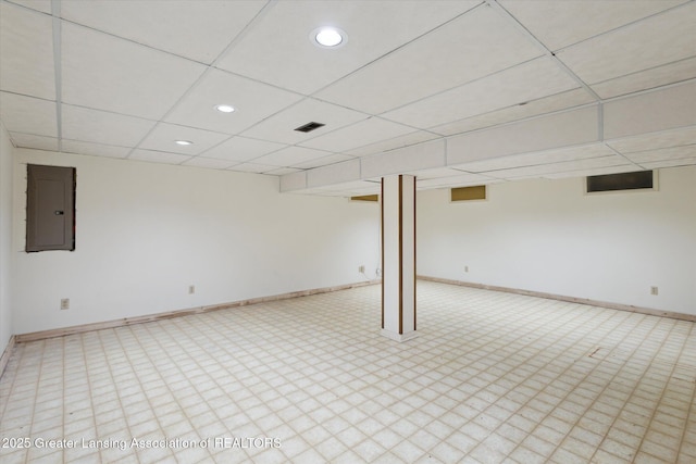 1116 W Service Rd, Mason, MI 48854 - finished below grade area with electric panel, baseboards, a paneled ceiling, and recessed lighting