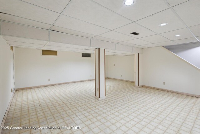 1116 W Service Rd, Mason, MI 48854 - finished below grade area featuring a drop ceiling, baseboards, recessed lighting, and tile patterned floors