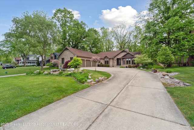 12728 Oneida Woods Trl, Grand Ledge, MI 48837 - view of front facade featuring driveway, a garage, a front lawn, a chimney, and brick siding