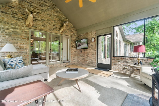 12728 Oneida Woods Trl, Grand Ledge, MI 48837 - sunroom with ceiling fan, brick wall, carpet, and high vaulted ceiling