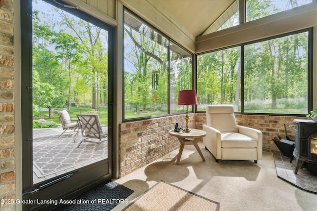 12728 Oneida Woods Trl, Grand Ledge, MI 48837 - sunroom / solarium with a wood stove and vaulted ceiling