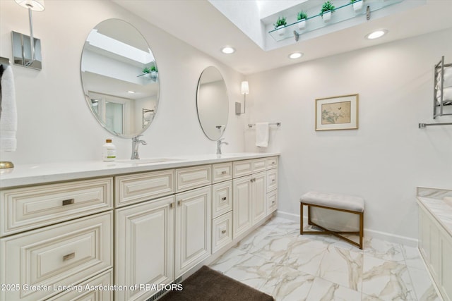 12728 Oneida Woods Trl, Grand Ledge, MI 48837 - full bath with a skylight, double vanity, marble finish flooring, recessed lighting, and baseboards