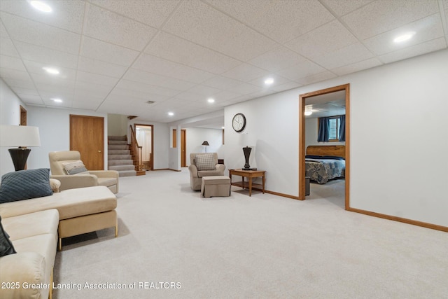 12728 Oneida Woods Trl, Grand Ledge, MI 48837 - carpeted living room with stairs, baseboards, a paneled ceiling, and recessed lighting