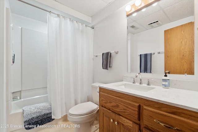 12728 Oneida Woods Trl, Grand Ledge, MI 48837 - full bathroom with vanity, shower / bath combination with curtain, toilet, and a drop ceiling