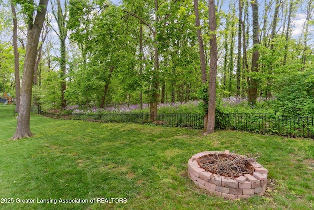 12728 Oneida Woods Trl, Grand Ledge, MI 48837 - view of yard with a fire pit