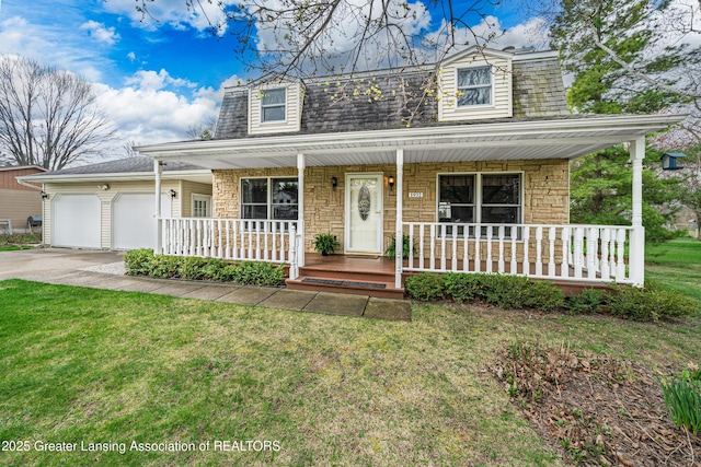 1932 Maple Shade Dr, Williamston, MI 48895 - view of front facade with a porch, an attached garage, concrete driveway, and a front yard