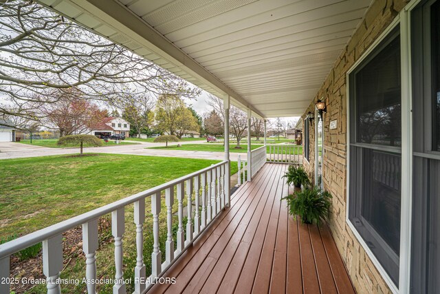 1932 Maple Shade Dr, Williamston, MI 48895 - wooden porch featuring a yard
