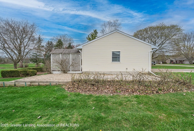 1932 Maple Shade Dr, Williamston, MI 48895 - view of property exterior featuring a yard