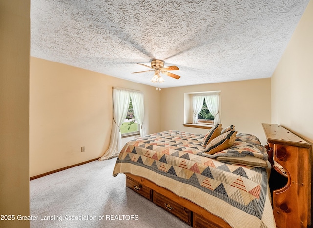 1932 Maple Shade Dr, Williamston, MI 48895 - bedroom with carpet, ceiling fan, baseboards, and a textured ceiling