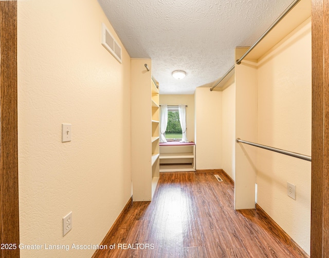 1932 Maple Shade Dr, Williamston, MI 48895 - walk in closet with dark wood-type flooring