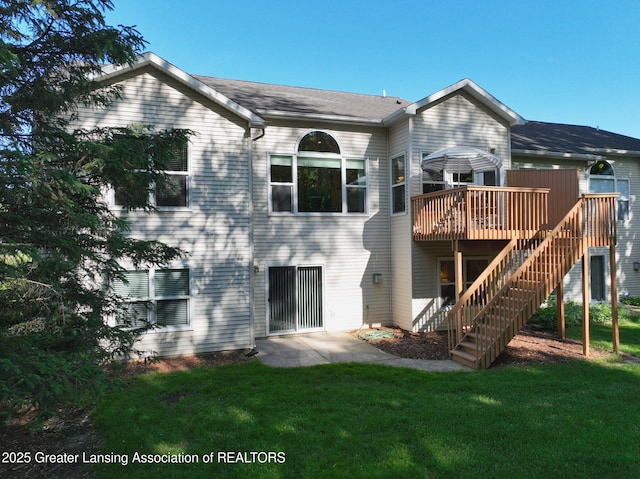 5167 Sapphire Cir, East Lansing, MI 48823 - rear view of property with a deck, a yard, and stairway