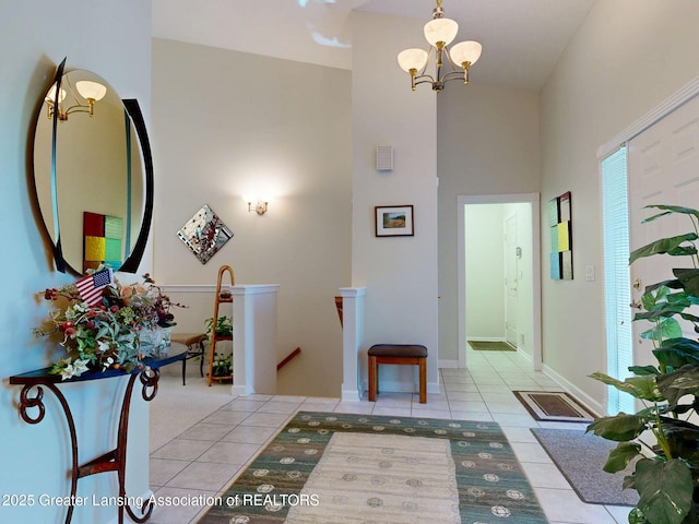 5167 Sapphire Cir, East Lansing, MI 48823 - foyer entrance with tile patterned flooring, a chandelier, and a high ceiling