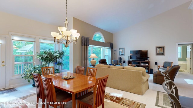 5167 Sapphire Cir, East Lansing, MI 48823 - dining area featuring high vaulted ceiling and a chandelier