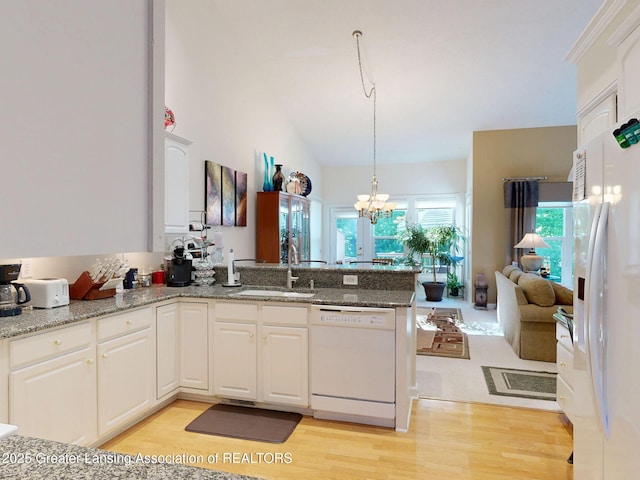 5167 Sapphire Cir, East Lansing, MI 48823 - kitchen featuring white appliances, a sink, a peninsula, light wood-style flooring, and white cabinets