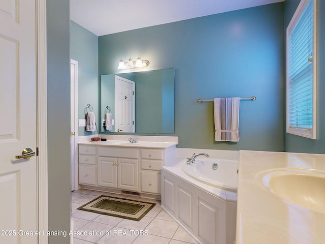5167 Sapphire Cir, East Lansing, MI 48823 - bathroom featuring vanity, a garden tub, and tile patterned floors