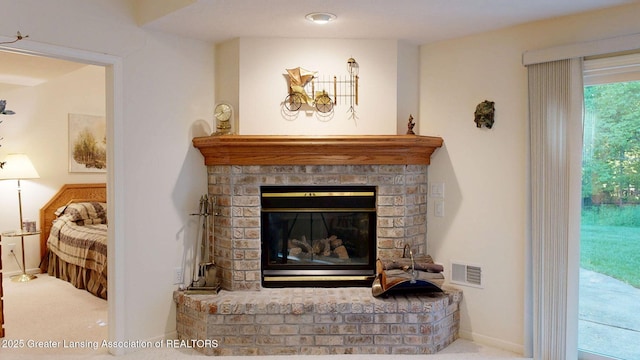 5167 Sapphire Cir, East Lansing, MI 48823 - detailed view of a fireplace and carpet flooring