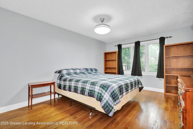 1615 Willow Creek Dr, Lansing, MI 48917 - bedroom featuring wood finished floors and baseboards