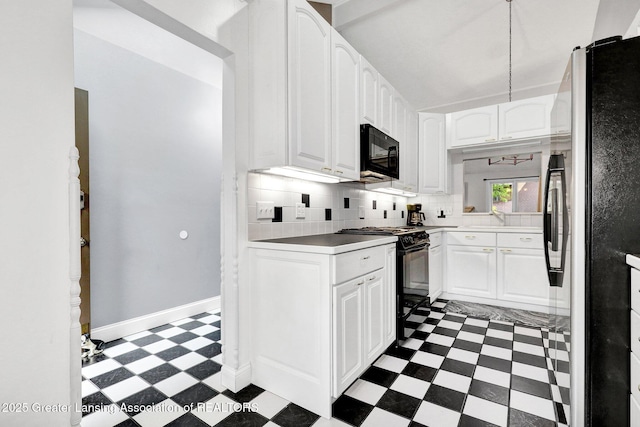 1615 Willow Creek Dr, Lansing, MI 48917 - kitchen featuring tile patterned floors, black appliances, white cabinets, and backsplash