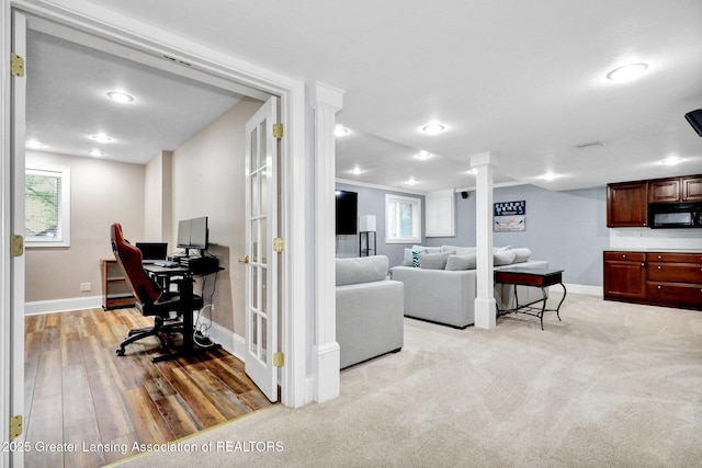1615 Willow Creek Dr, Lansing, MI 48917 - living area featuring baseboards, a desk, ornate columns, light wood-type flooring, and recessed lighting