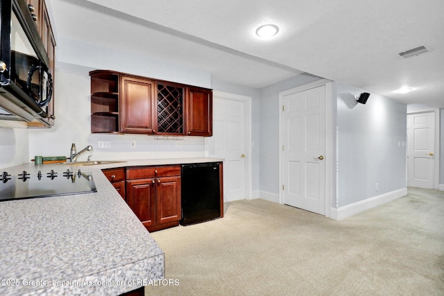 1615 Willow Creek Dr, Lansing, MI 48917 - kitchen with black appliances, light carpet, light countertops, a sink, and open shelves