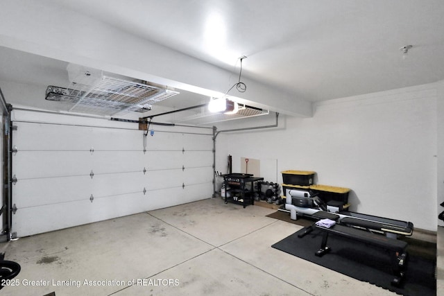 1615 Willow Creek Dr, Lansing, MI 48917 - garage featuring a garage door opener