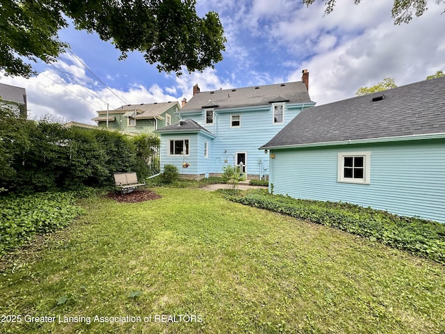 841 Huntington Rd, East Lansing, MI 48823 - back of house with a yard