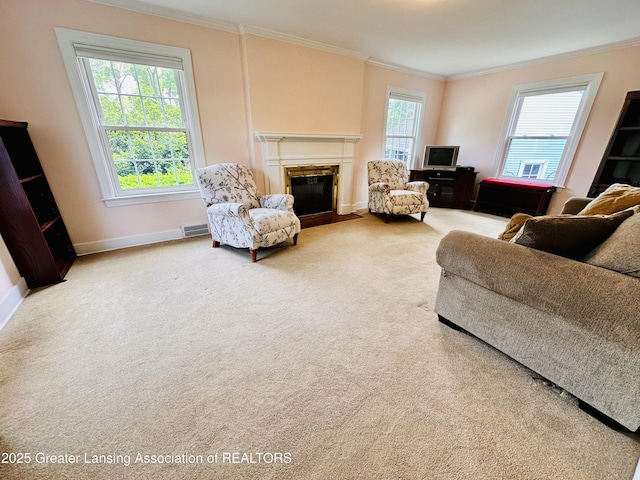 841 Huntington Rd, East Lansing, MI 48823 - carpeted living room with crown molding, a fireplace with flush hearth, and baseboards