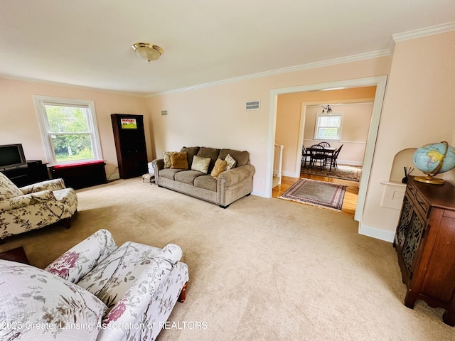 841 Huntington Rd, East Lansing, MI 48823 - living area with ornamental molding, carpet, and baseboards