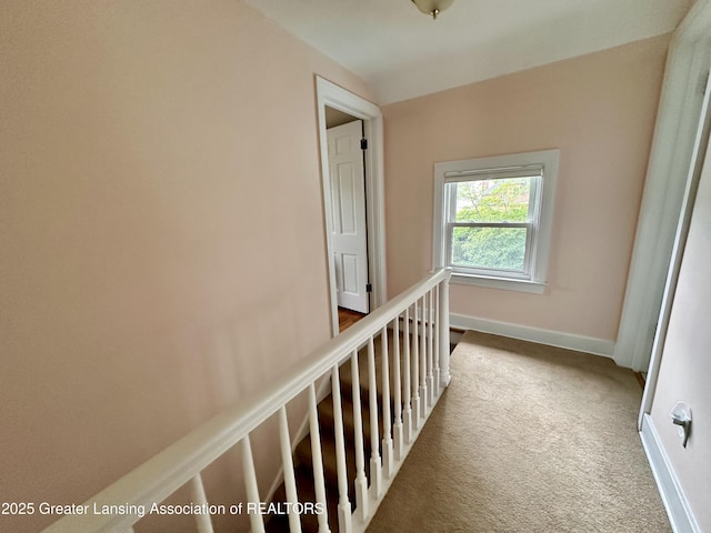841 Huntington Rd, East Lansing, MI 48823 - hall with carpet flooring, baseboards, and an upstairs landing