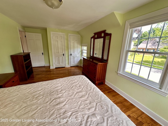 841 Huntington Rd, East Lansing, MI 48823 - bedroom with wood finished floors, multiple windows, and baseboards