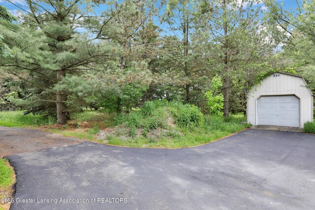 345 Linn Rd, Williamston, MI 48895 - detached garage featuring driveway