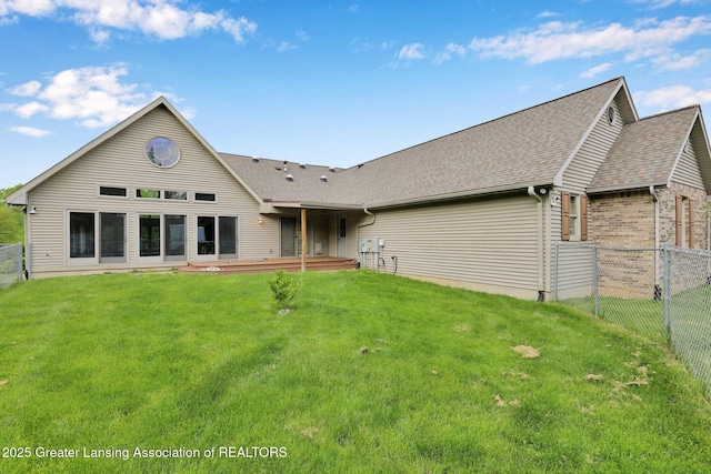 345 Linn Rd, Williamston, MI 48895 - rear view of property featuring a fenced backyard and a shingled roof