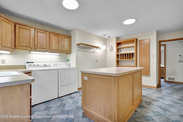 345 Linn Rd, Williamston, MI 48895 - washroom with cabinet space, washing machine and clothes dryer, and stone finish floors