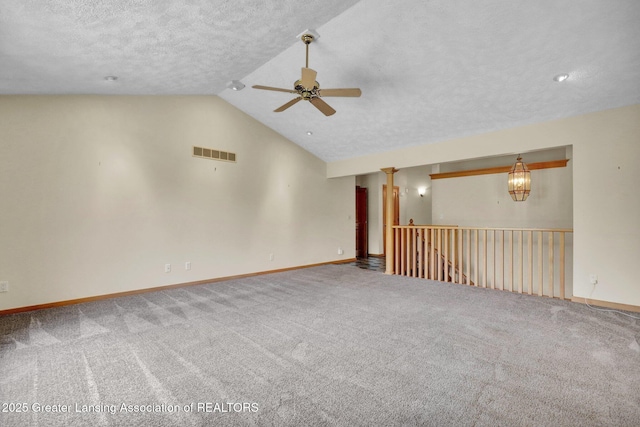 345 Linn Rd, Williamston, MI 48895 - carpeted empty room with a ceiling fan, vaulted ceiling, and a textured ceiling