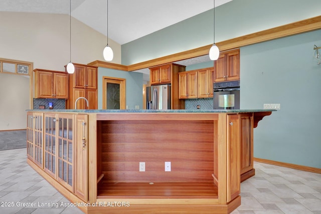345 Linn Rd, Williamston, MI 48895 - kitchen with black oven, stainless steel fridge, brown cabinetry, backsplash, and high vaulted ceiling