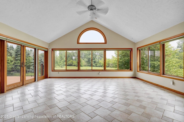 345 Linn Rd, Williamston, MI 48895 - unfurnished sunroom with a textured ceiling, high vaulted ceiling, and french doors