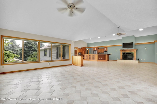 345 Linn Rd, Williamston, MI 48895 - unfurnished living room with ceiling fan, a tile fireplace, recessed lighting, and high vaulted ceiling