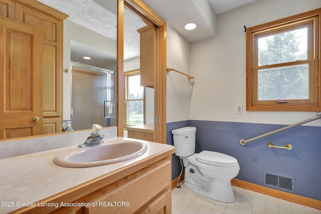 345 Linn Rd, Williamston, MI 48895 - full bath featuring tile patterned flooring, vanity, and a shower stall